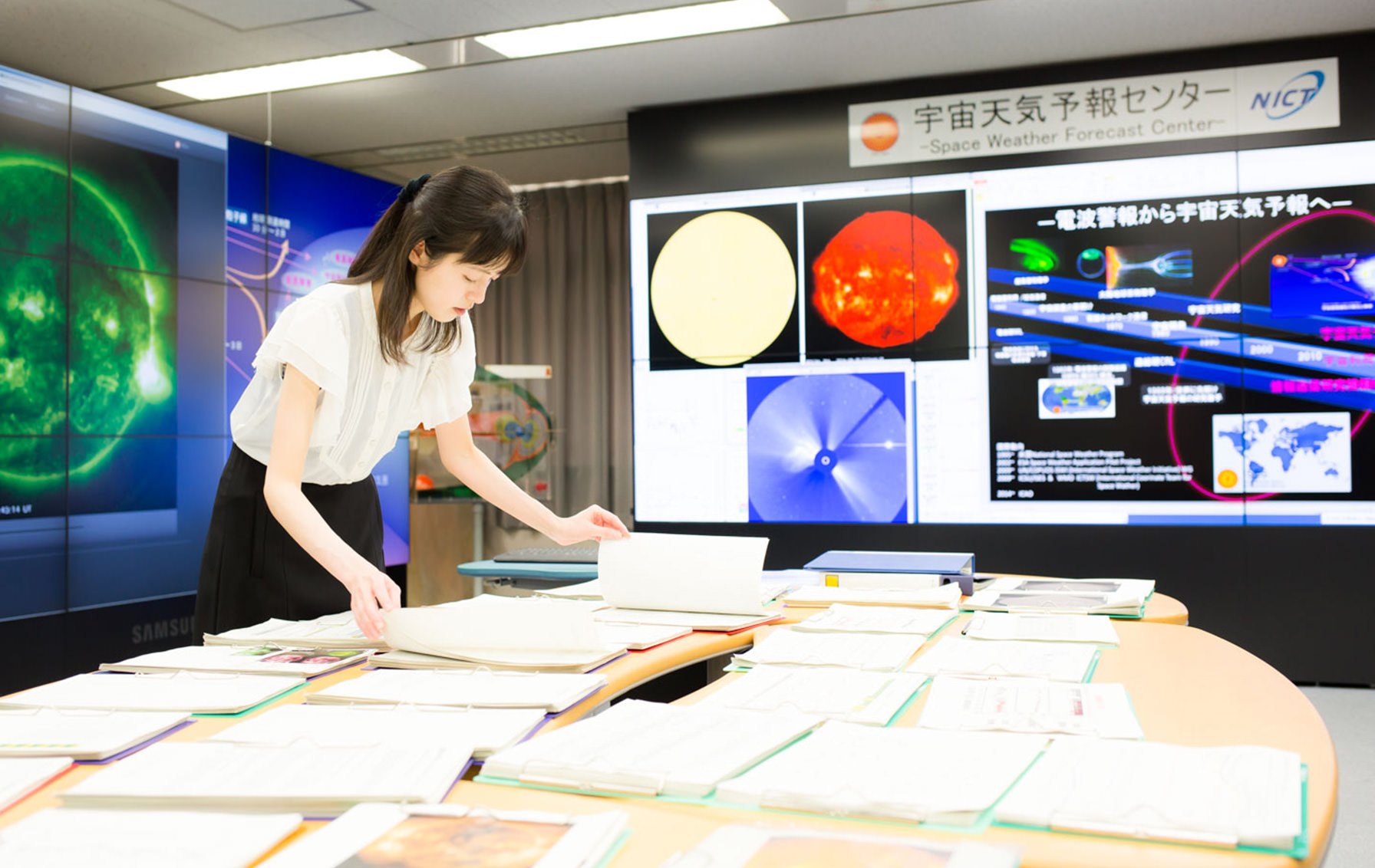 Senior Researcher Nakamizo checking the space weather forecast data.